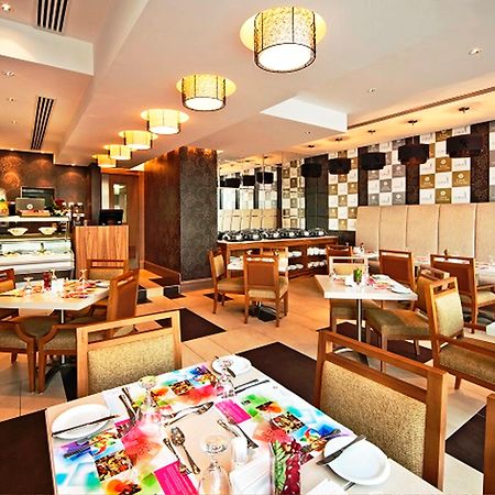 Oaks Liwa Executive Suites Αμπού Ντάμπι Εστιατόριο φωτογραφία